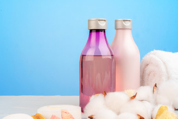 Plastic bottles of body care and beauty products composition close up