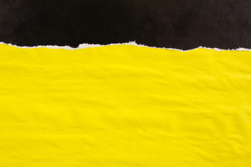 Yellow and black crumpled torn paper posters texture background. Can be used for text.