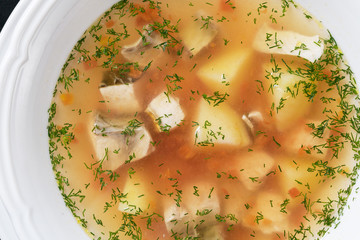fish soup in a white plate