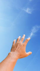 hand on sky on blue sky