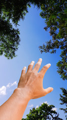 hand on sky on blue sky
