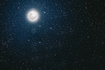 Naklejka na ściany i meble backgrounds night sky with stars and moon and clouds.