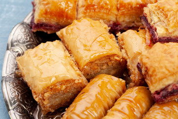 Plate of baklava dessert close up served on table