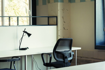 Morning in coworking. Contemporary office interior with furniture