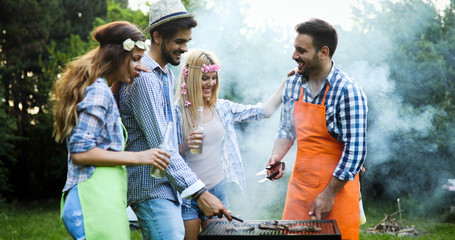 Group of friends making barbecue