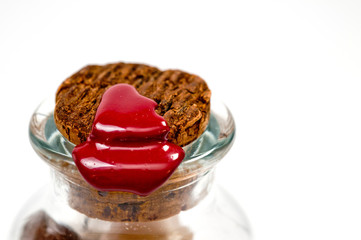 Natural cork in a glass bottle sealed with red sealing wax filmed on a large white background