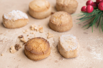 Fototapeta na wymiar Variety of Spanish shortbreads Mantecados, polvorones, nevaditos with festive detail.. Typical sweets consumed at Christmas time in Spain.
