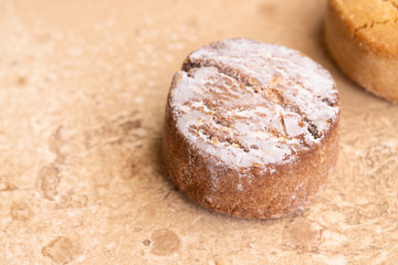 Close up of Spanish Christmas traditional treats Mantecado,  popular shortbread made from: wheat flour, sugar,nuts and lard.Copy space
