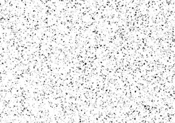 Small uneven spots and particles of debris. Abstract vector texture.  Distressed uneven background. Grunge texture overlay with fine grains isolated on white background. Vector illustration. EPS10.