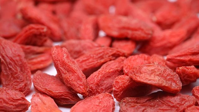 side view herb medicine GouQiZi or Lycii Fructus or Babury Wolfberry Fruit rotate and pause