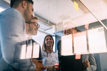 Business people having fun and chatting at workplace office
