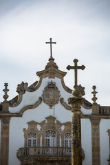 Detailed view at the pillory with a cross and the pediment cornice at the Church of Mercy, baroque...