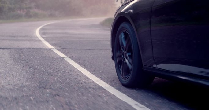 Reflecting everything around with its glossy surface, the premium car rides asphalt road where you can observe the suspension and how the tires perceive driving conditions