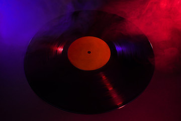 Spotlight vinyl record. Old vintage vinyl record  music background.