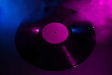 Spotlight vinyl record. Old vintage vinyl record  music background.