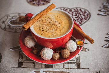 Cozy Christmas cup of coffee, magic evening at home. Scene of holidays detail