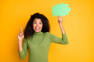 Photo of casual cheerful trendy interested girl having come up with creative idea with forefinger up and bubble above isolated vivid color background