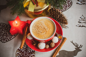 Obraz na płótnie Canvas Cozy Christmas cup of coffee, magic evening at home. Scene of holidays detail