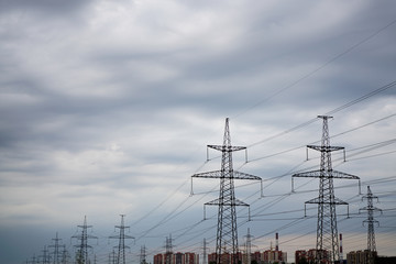 power transmission line in the city with cloudy sky