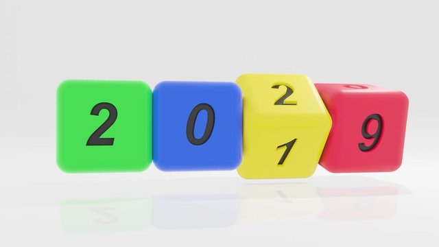 2020 New year change, turn. 2020 start 2019 end, BLUE, red, green and yellow dice isolated against white background.