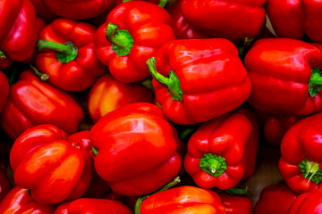 Red bell pepper close-up, wallpaper, pattern. A lot of ripe red pepper, the concept of the crop, veggie nutrition, vitamin food.