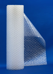 Packaging bubble wrap roll on blue