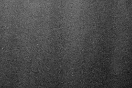 Gray color cardboard. Clean light grey paper texture. High resolution photo.