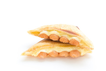 Croissant stuffed with sausage and cheese isolated on white background.