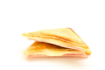 Croissant stuffed with ham and cheese isolated on white background.