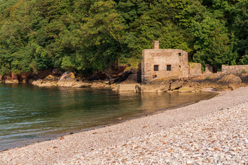 The disused bath-house at Elberry Cove, Torbay, England, UK