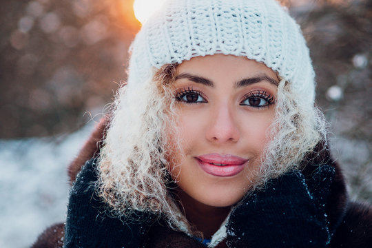 beautiful young afro american woman in sunny winter day