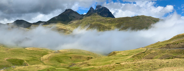 Stunning view with mountains, clouds and fog in the Pyrenees, between the Spanish and French border