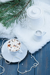 Christmas cocoa with marshmallows and cookies on wooden background