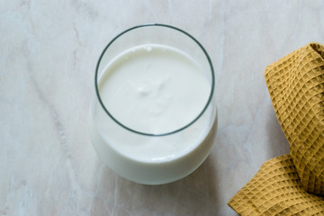 Organic Probiotic Milk Kefir Yogurt in Glass Cup Ready to Drink.