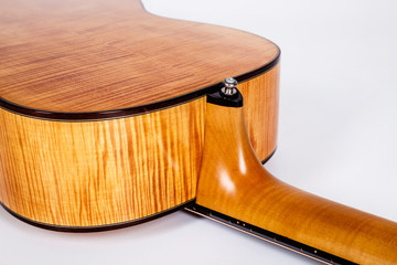 wood texture of lower deck of six strings acoustic guitar on white background. guitar shape