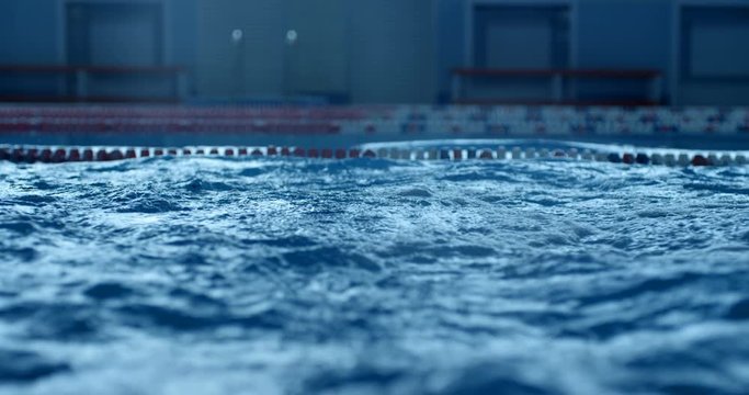 Big waves like boiling water in a swimming pool after a professional swimmer swam in it. Slow mo, slo mo, slow motion, high speed camera