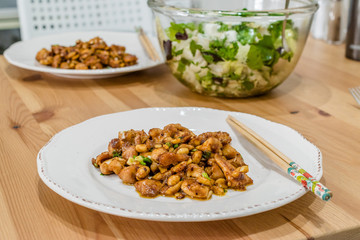 Homemade Kung Pao Chicken with Peanuts, Peppers, Soy Sauce, Green Chives and Veggies.