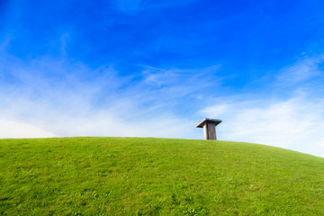 A podium or sign post in a park. Blue sky with clouds. Saint Peter's Mountain, La Coruna, Spain