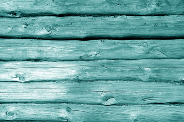 Weathered wooden fence in cyan tone.