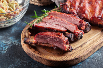 Spicy barbecued pork ribs served with BBQ sauce