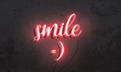 Neon sign Smile on grunge background