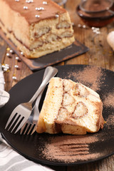 festive tiramisu cake on wood background