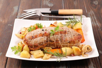 roasted beef or veal with vegetable and herbs