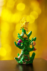 Christmas tree with toys on the branches and a yellow star on top