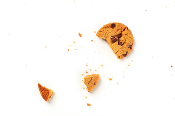 Chocolate chip cookie, gluten free, broken with crumbs on a white background with a place for text
