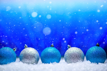 Abstract background, Christmas toys on a boke background. Happy New Year, with falling snow, bright background