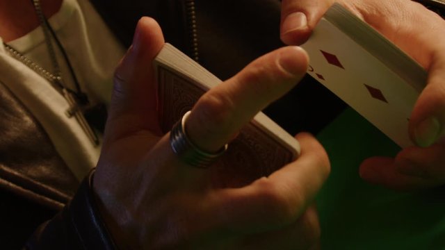 Flying cards slow motion shot, magician shows tricks, isolated, shot on Red Weapon Helium