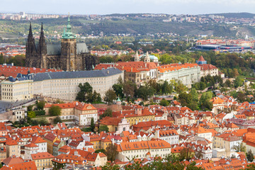Naklejka na ściany i meble city views Prague autumn. St. Vitus Cathedral. Tiled roofs. View from above. Petrshin.