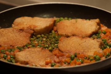 Meat with peas and carrots