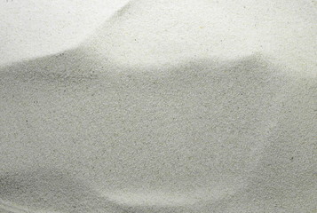 Gray Sand on the beach as background. Sand Texture. Gray sand. Background from fine sand.